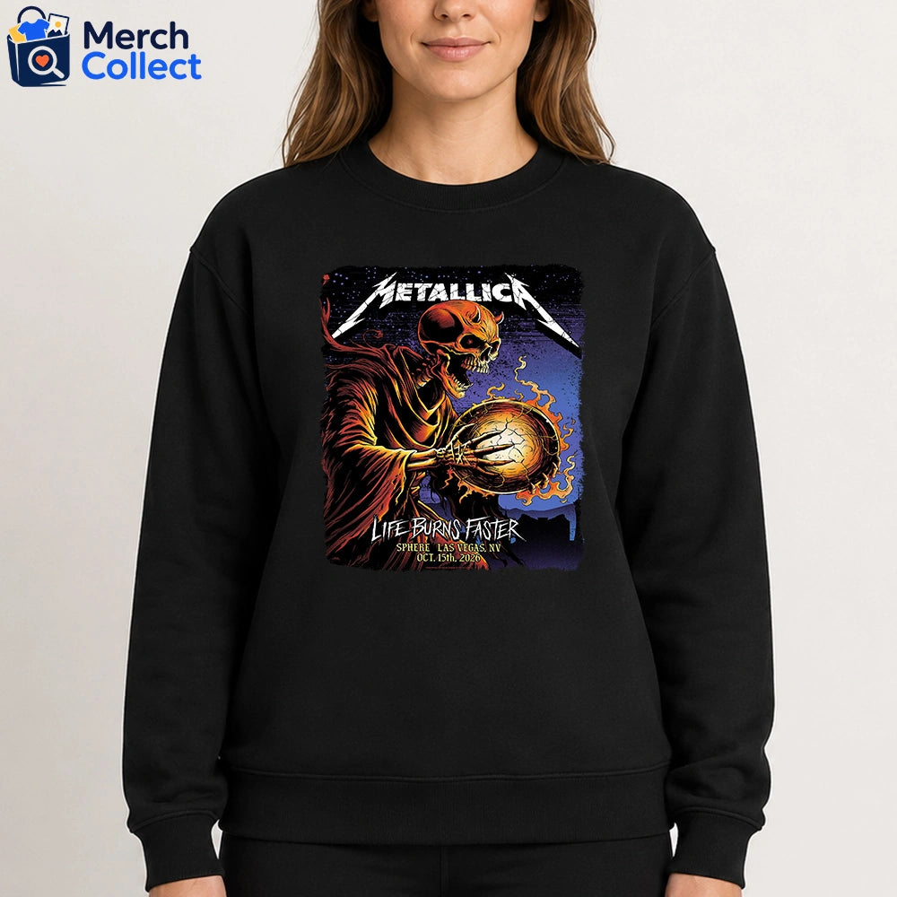 Metallica Life Burns Faster October 15 2026 Sphere Las Vegas T-Shirt featuring Brandon Heart Flaming Orb Reaper artwork with a horned skeleton holding a burning cracked orb on the front.